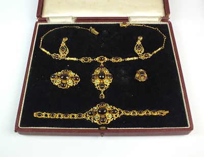 Lot 126 - A cased suite of Zoltan White & Co silver gilt garnet and turquoise set jewellery