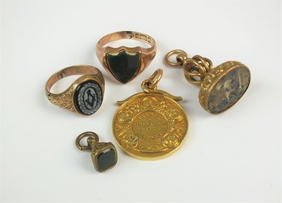 Lot 121 - Two signet rings, two fobs and a medallion