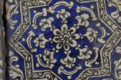 Lot 667 - Seven associated Persian tin-glazed tiles, 18th century or earlier