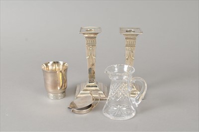 Lot 334 - A pair of silver mounted candlesticks