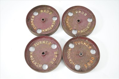 Lot 401 - Four small 20th century carriage railway cast iron wheels, 'Turner bros, Newtown'