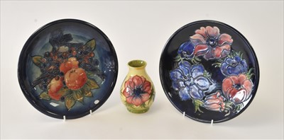 Lot 95 - Two Moorcroft plates and a vase