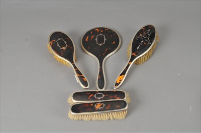 Lot 348 - A four piece silver and tortoiseshell mounted dressing table set