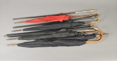 Lot 493 - A bundle of Victorian and later walking canes and parasols