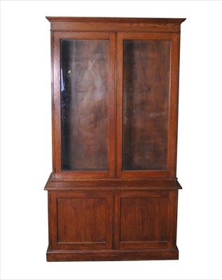 Lot 606 - A tall oak bookcase