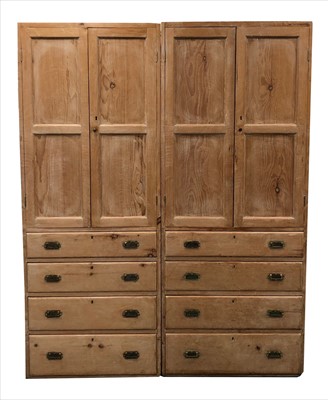 Lot 714 - A pair of tall pale stripped pine hall cupboards