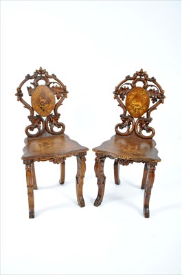 Lot 731 - A pair of Black Forrest type 19th century continental hall chairs