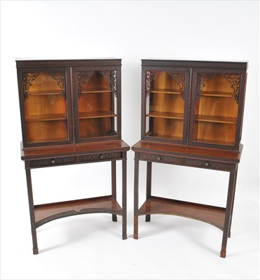 Lot 523 - A pair of Edwardian mahogany Chippendale revival cabinets