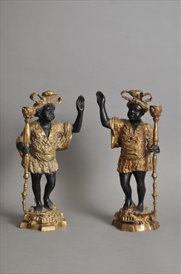 Lot 395 - A pair of decorative cast candlesticks in the form of blackamoor figures