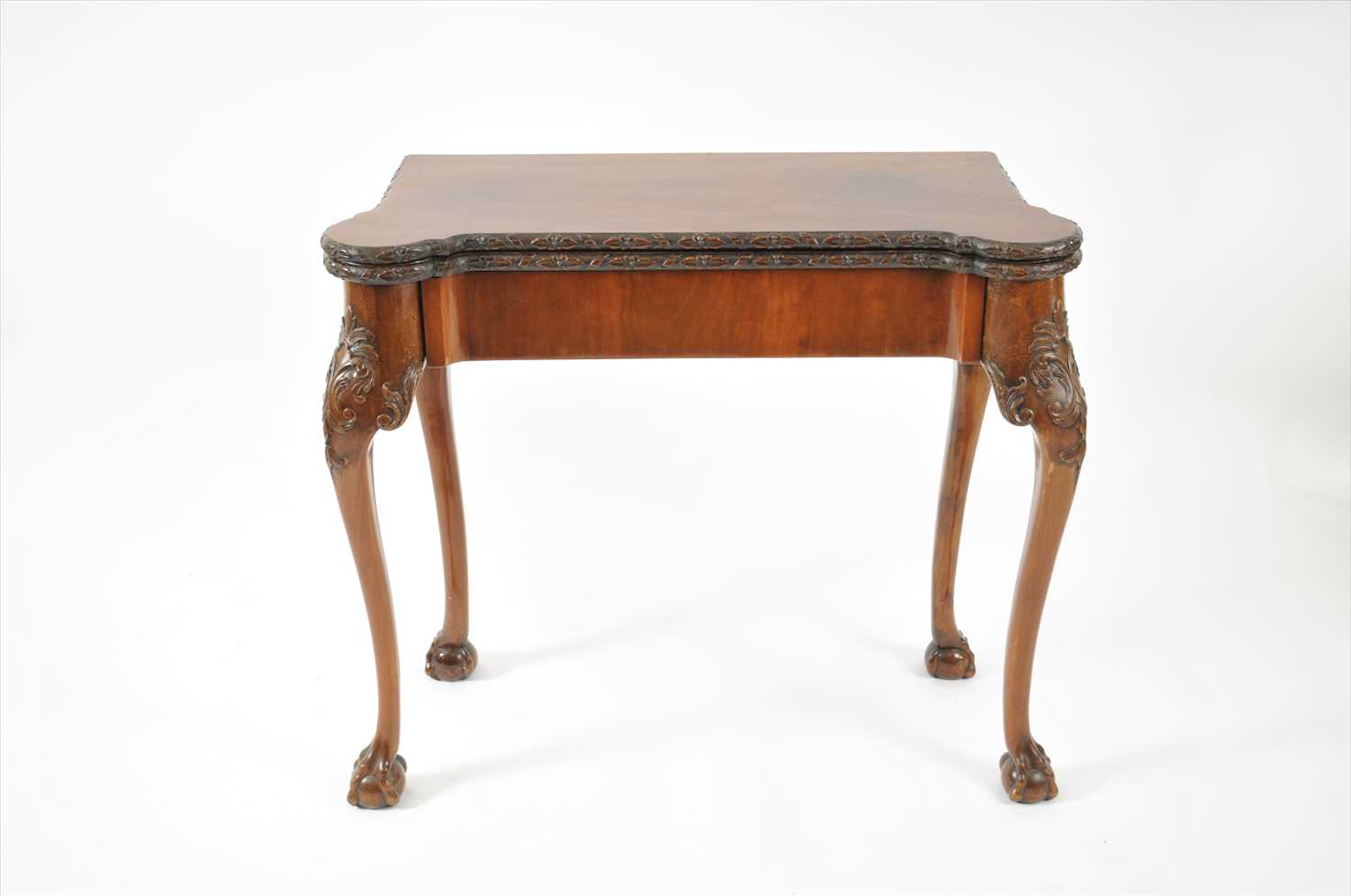 Lot 734 - A 19th century folding mahogany card table in the George II style