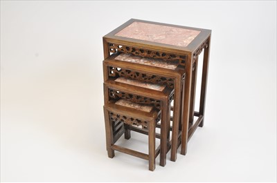 Lot 457 - A nest of four Chinese hardwood occasional tables