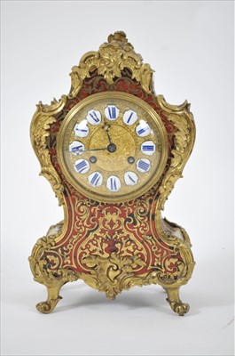 Lot 692 - A late 19th century parquetry inlaid boulle mantel clock in the Louis XV style