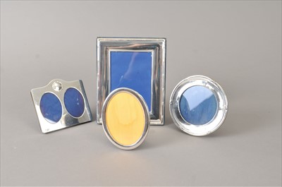 Lot 324 - Thee silver mounted frames and a silver plated frame