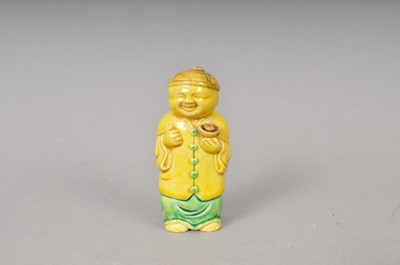 Lot 432 - A Chinese earthenware model of a standing figure