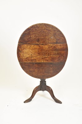 Lot 384 - A 19th century oak tilt-top table