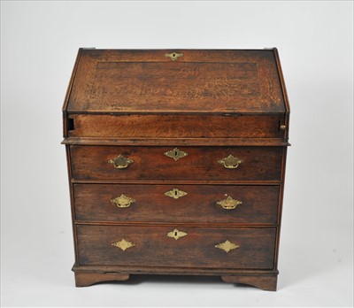 Lot 547 - A George III country oak bureau