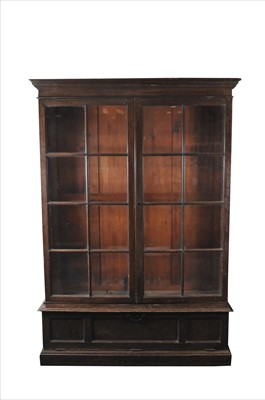 Lot 596 - A large stained oak glazed bookcase