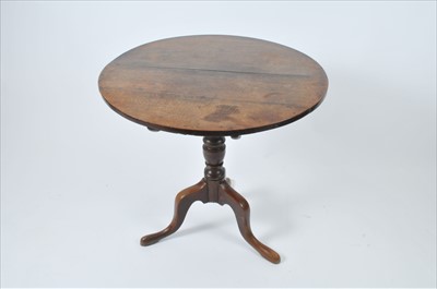 Lot 575 - A 19th century oak snap-top occasional tripod table