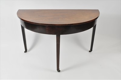 Lot 608 - A 19th century mahogany demi-lune side table
