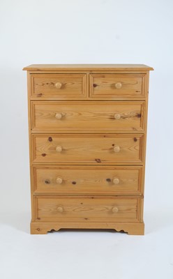 Lot 379 - A pale pine chest of two short and four long drawer