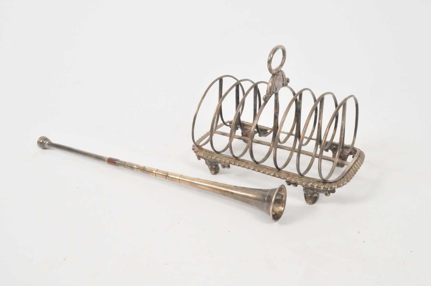 Lot 2 - A William IV silver six division toast rack