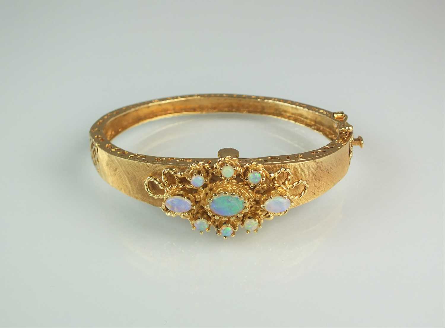 Lot 151 - An opal set Catena bangle wristwatch