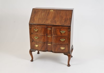 Lot 521 - A small Queen Anne style walnut veneered bombe-fronted bureau