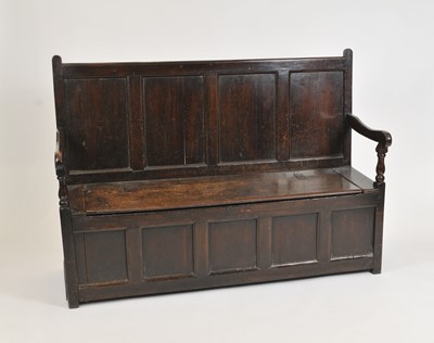Lot 365 - A large 19th century panelled country oak settle