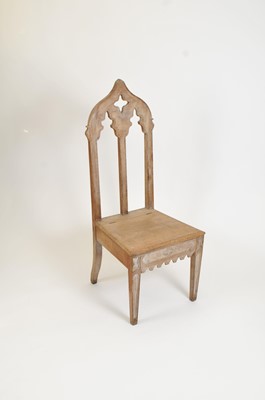 Lot 340 - A decorative limed oak high back chair in the Gothic style