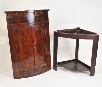 Lot 346 - A large Victorian bow-fronted mahogany corner cupboard on stand