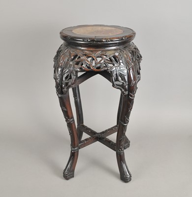 Lot 232 - A 19th century Chinese marble-topped carved hardwood jardinière stand