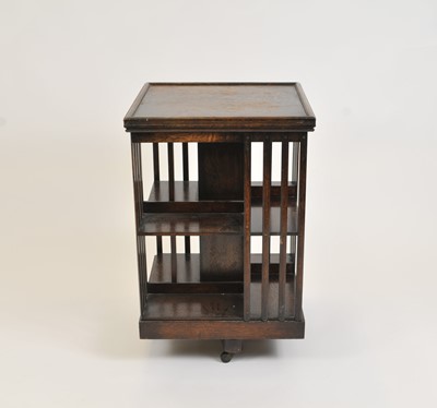 Lot 337 - A large early 20th century stained oak revolving bookcase