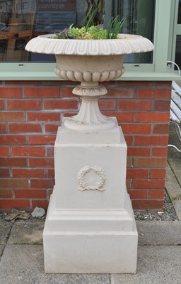 Lot 329 - A large pair of late 19th / early 20th century cast iron campagna urns