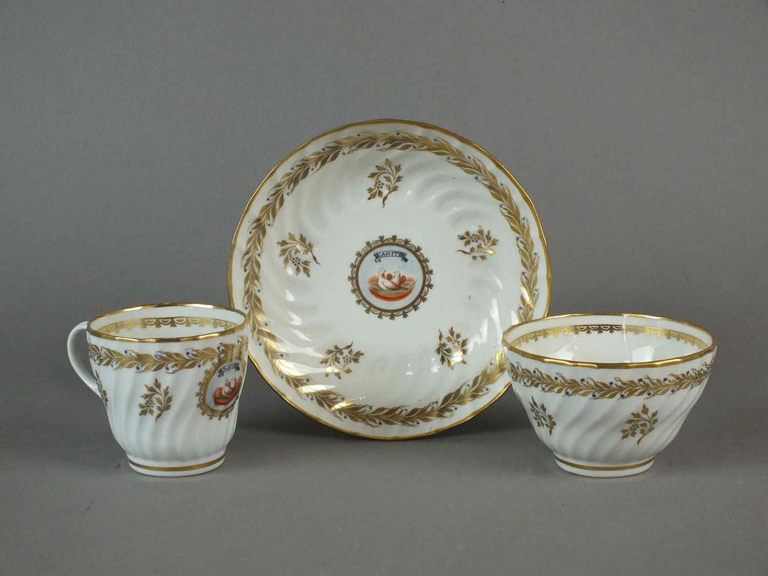 Lot 197 - Caughley 'L'Amitie' trio of tea bowl, coffee cup and saucer