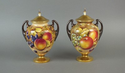Lot 353 - A pair of Royal Worcester twin-handled vases and covers