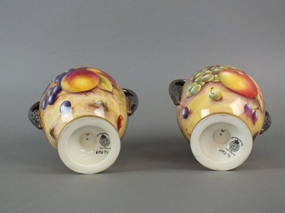 Lot 353 - A pair of Royal Worcester twin-handled vases and covers