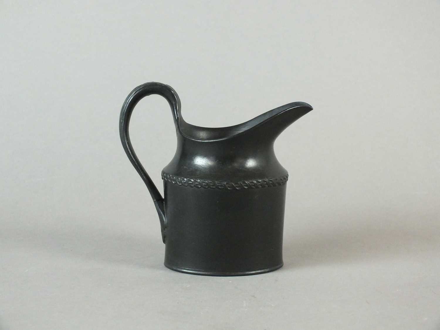 Lot 238 - A rare Caughley black basalt cream jug