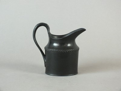 Lot 238 - A rare Caughley black basalt cream jug