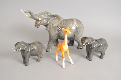 Lot 208 - Three Beswick elephants and a giraffe