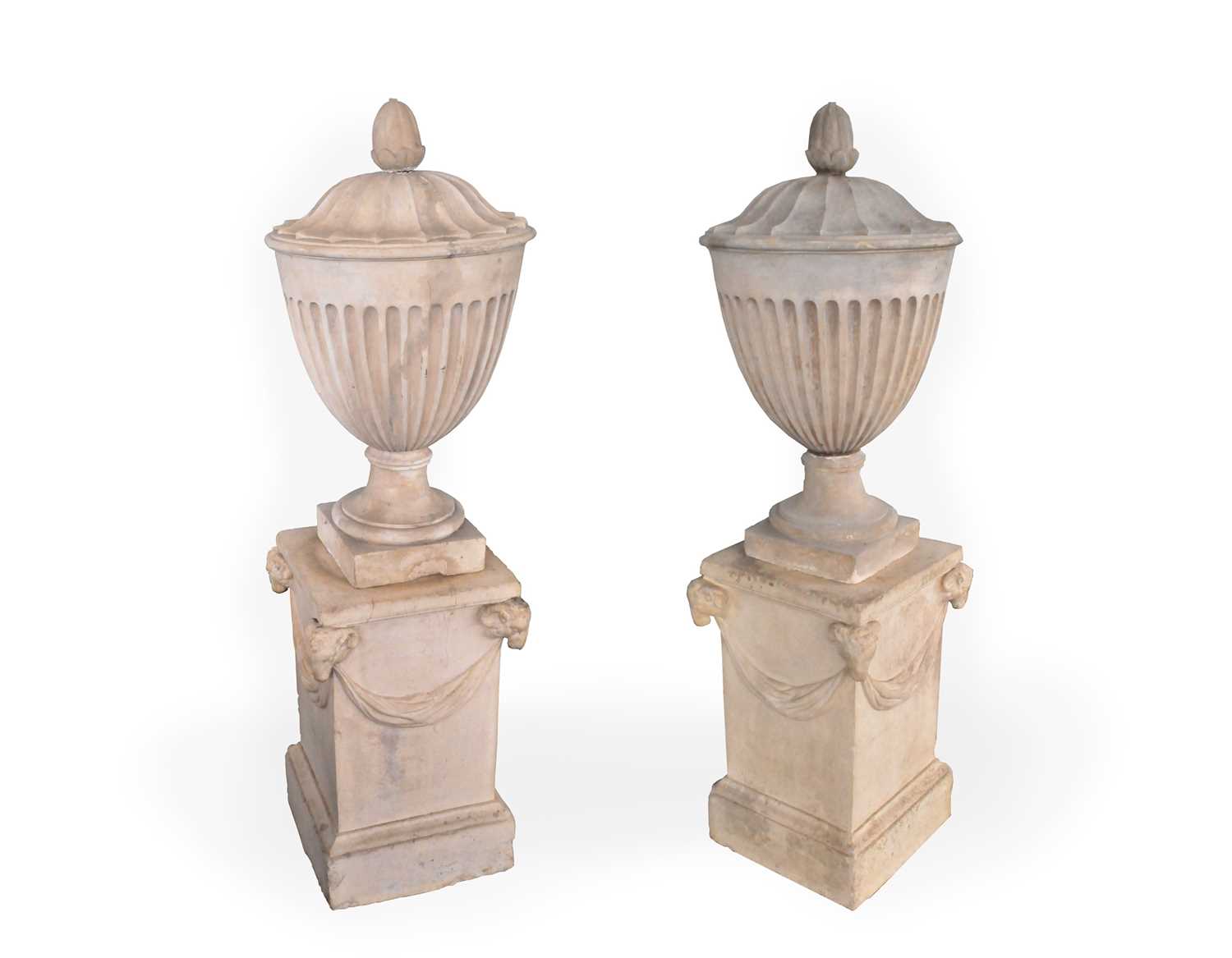 Lot 479 - A pair of Coade urns, with bud form finials...