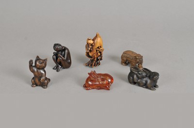 Lot 242 - A collection of carved Japanese netsuke