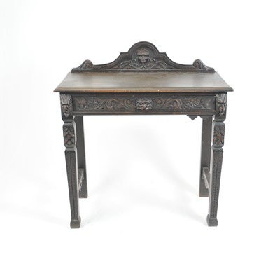 Lot 420 - A late 19th / early 20th century carved oak side table