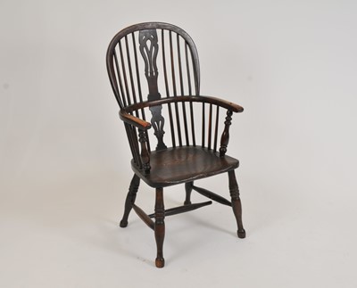 Lot 423 - A 19th century Windsor kitchen armchair