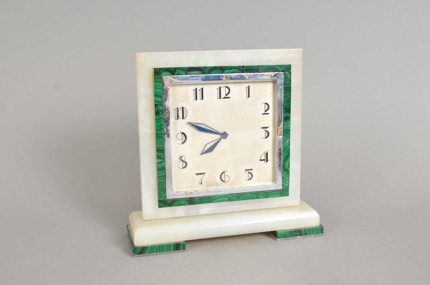 Lot 320 - An Art Deco Swiss-made onyx and malachite framed mantle clock