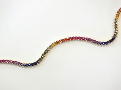 Lot 152 - A 9ct gold multi-coloured 'rainbow' sapphire bracelet
