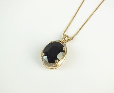 Lot 54 - A black spinel and white topaz pendant on chain
