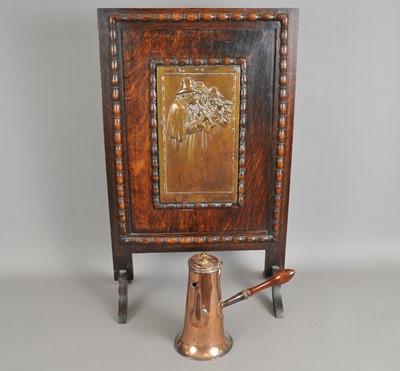 Lot 259 - An oak framed continental fire screen and a Victorian copper chocolate pot