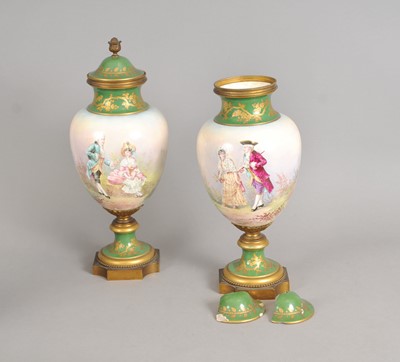 Lot 215 - A pair of French vases and covers