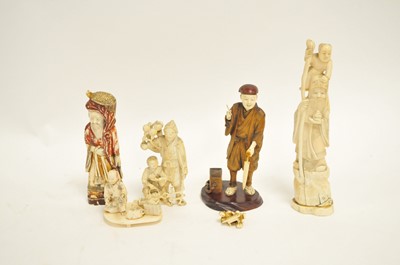 Lot 460 - A Meiji ivory and treen okimono of a street...