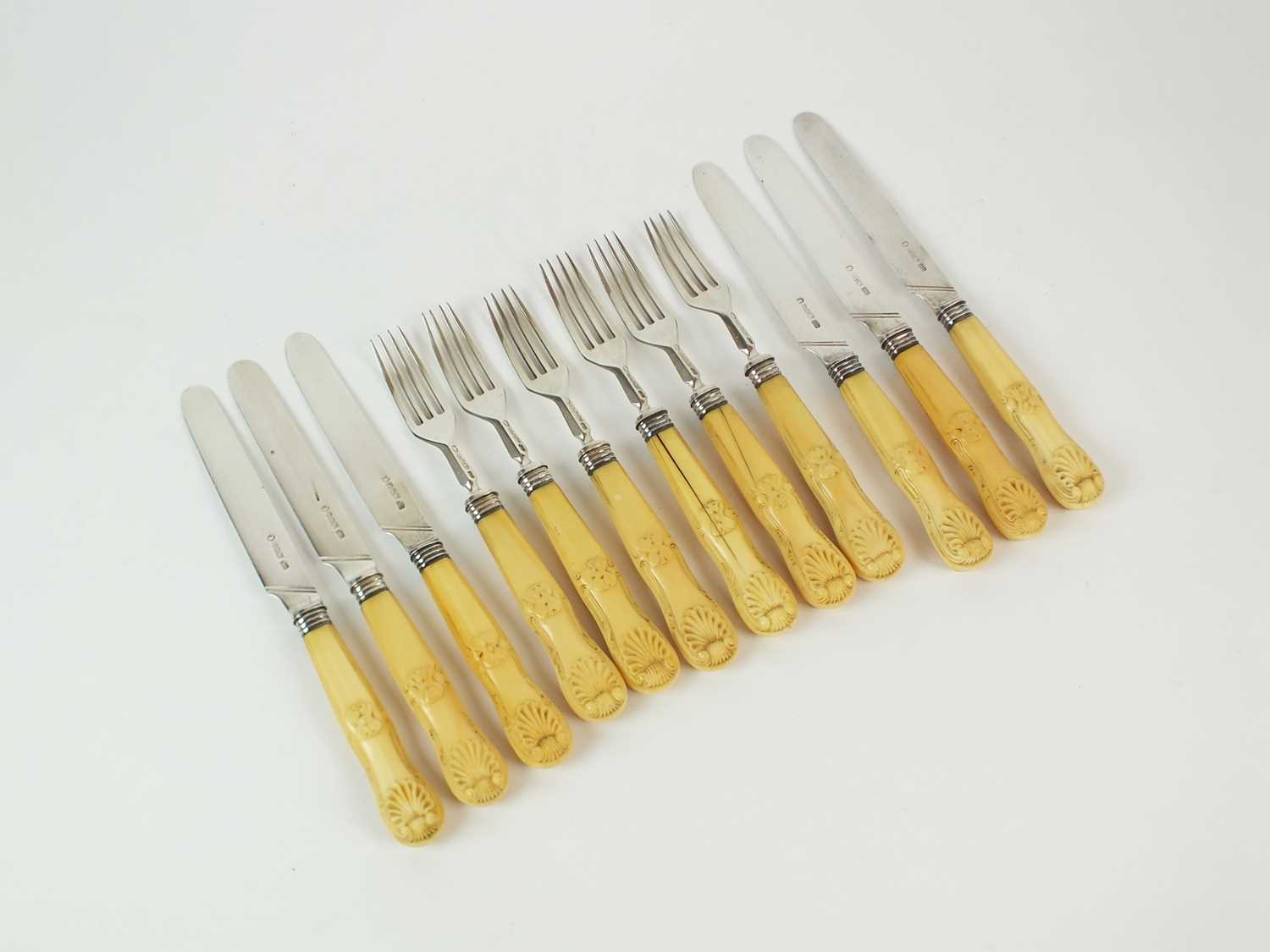 Lot 99 - A set of William IV ivory handled silver fruit knives and forks